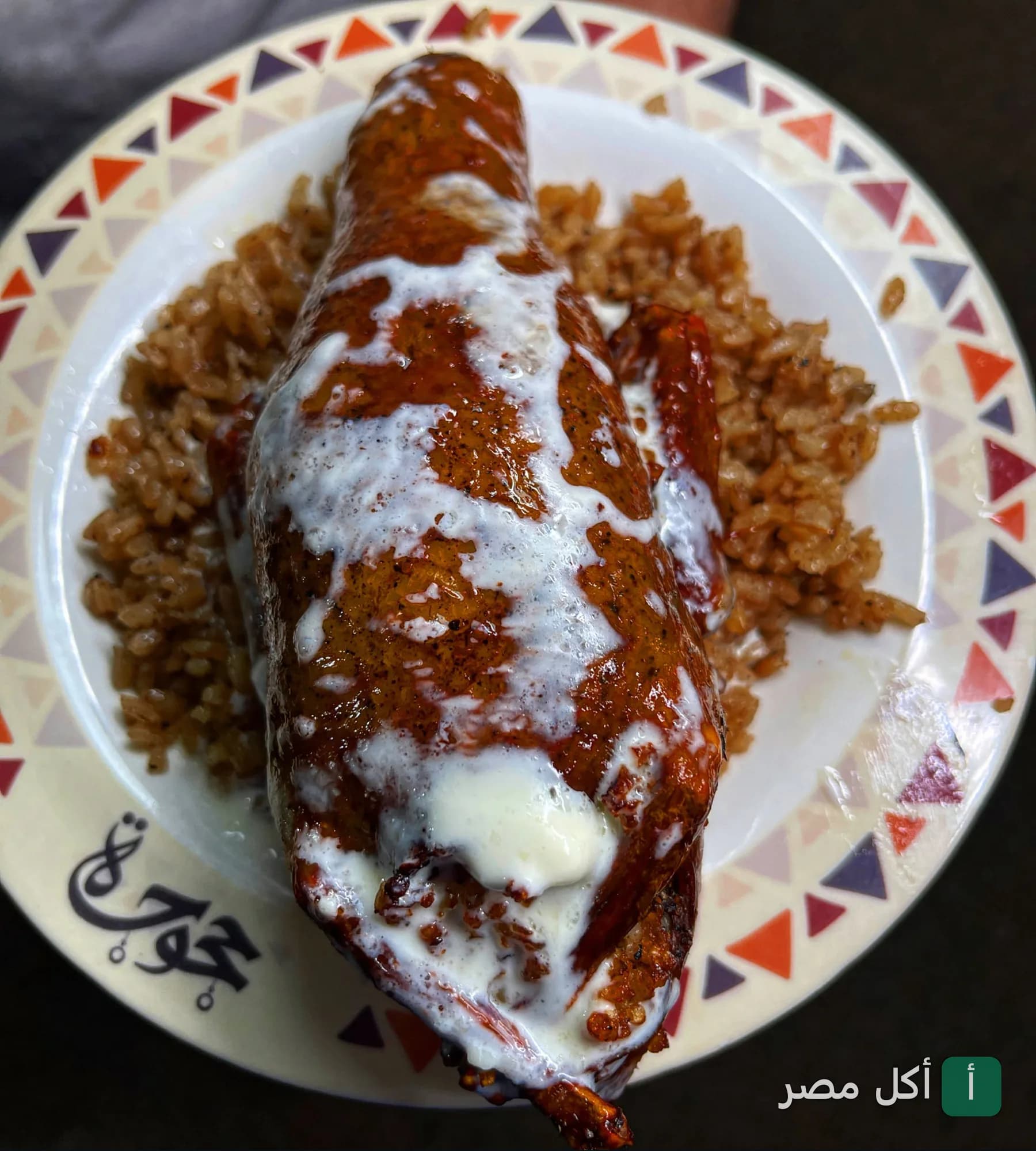 طبق حمام محشي بالأرز مع صوص أبيض في مطعم حجوجة بالإسكندرية