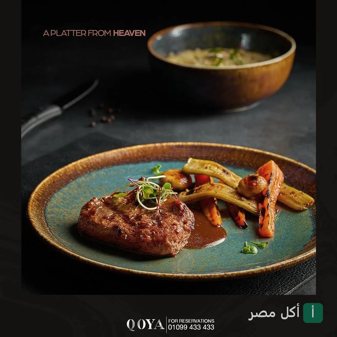 طبق ستيك مشوي مع خضروات في مطعم قويا بالقاهرة.