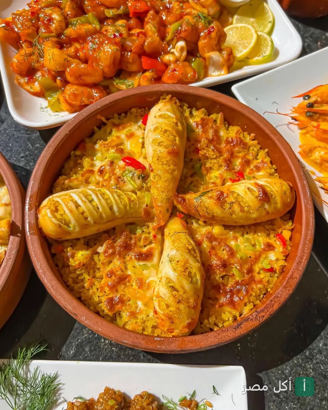 طاجن أرز بالسي فود مع سبيط محشي في مطعم أسماك المرشدي بالشيخ زايد