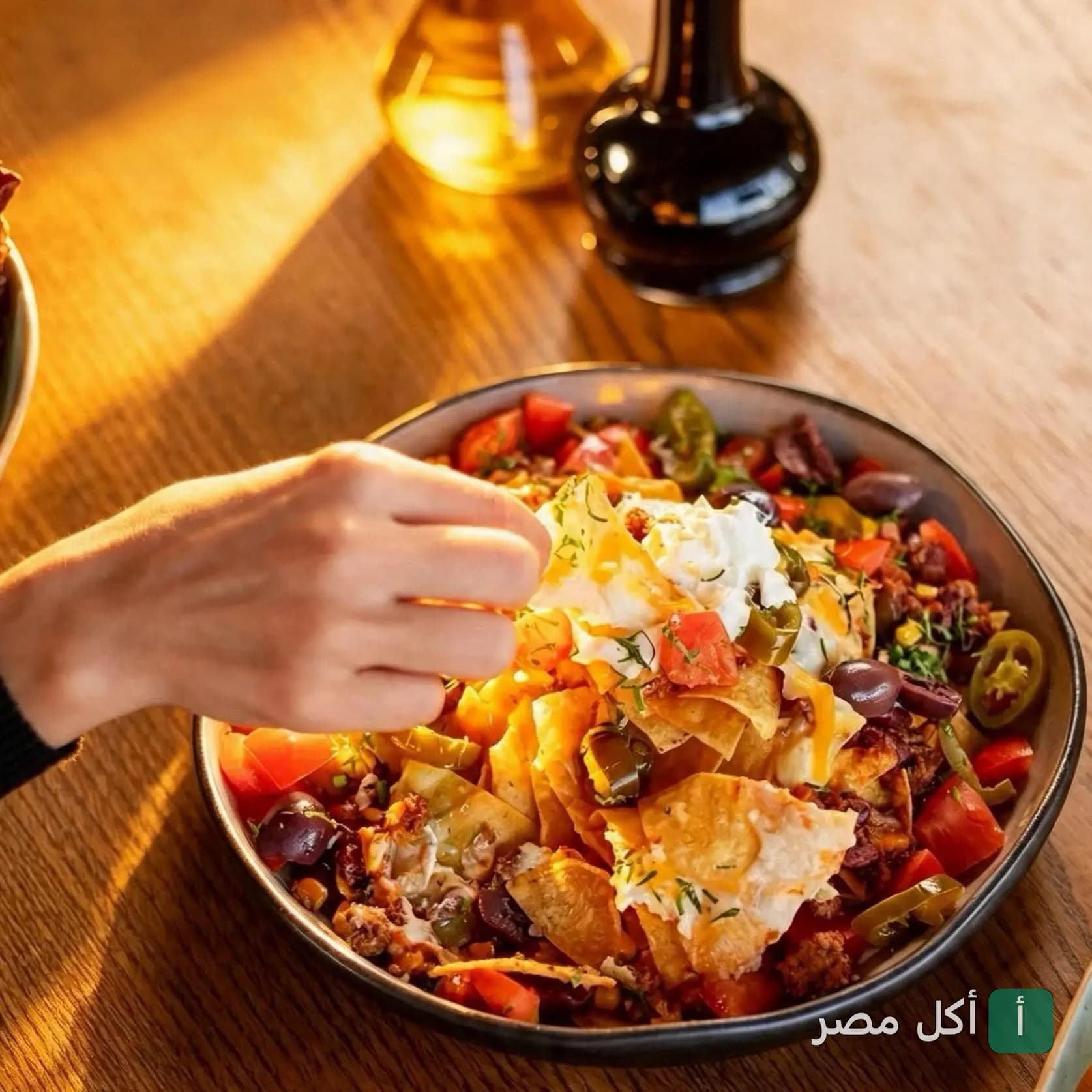 طبق ناتشوز غني بالخضروات والجبنة في مطعم أوركيد بأركان بلازا.