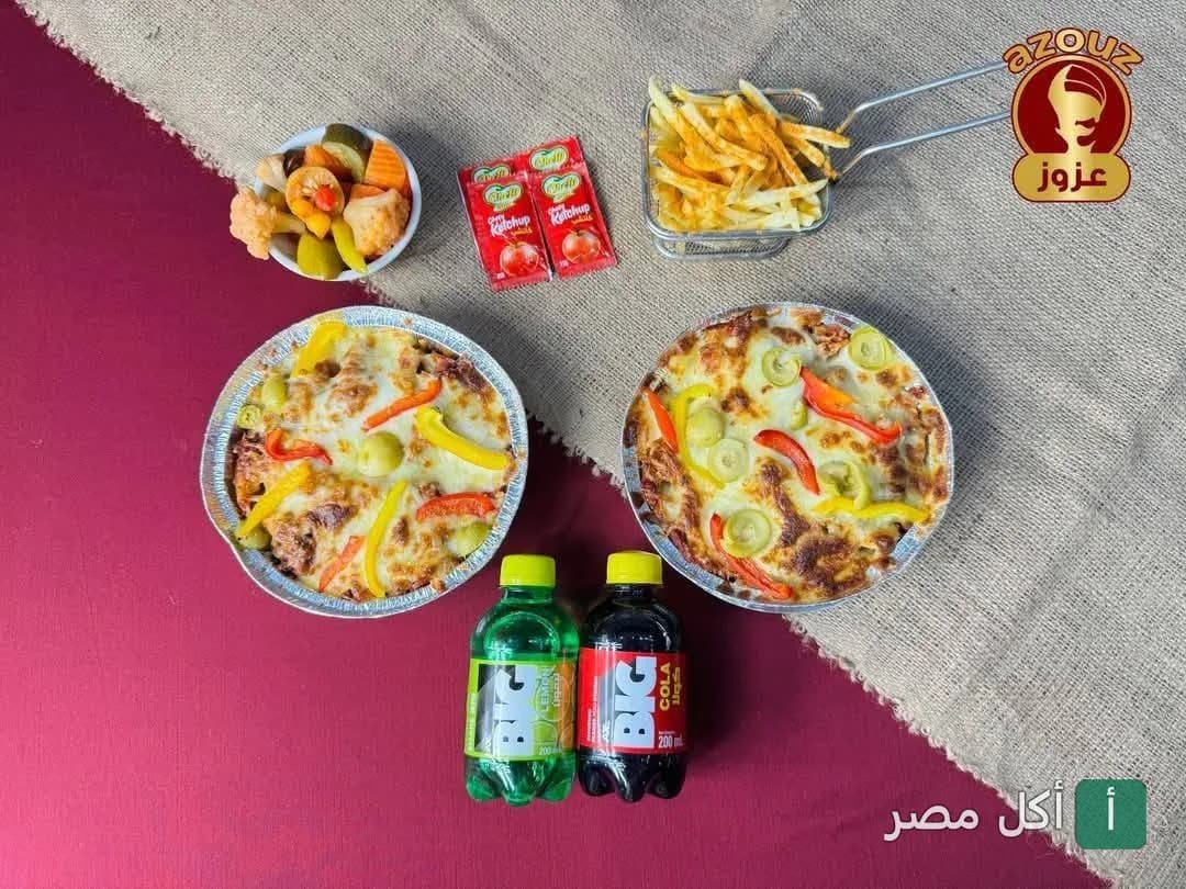 وجبة طواجن مع بطاطس مقلية ومخلل ومشروبات غازية من مطعم محمد عزوز الريدي في أطفيح