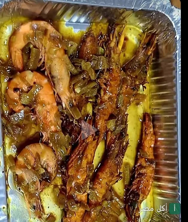 طبق جمبري مطهو بالزبدة والأعشاب في مطعم باترفلاي للمأكولات البحرية بالعطارين