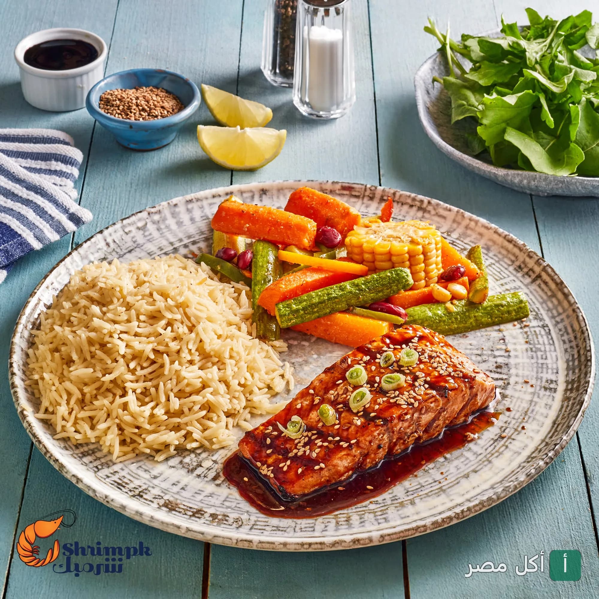طبق سمك مشوي مع أرز وخضار سوتيه من مطعم شريمبك في سيدي جابر بالإسكندرية.