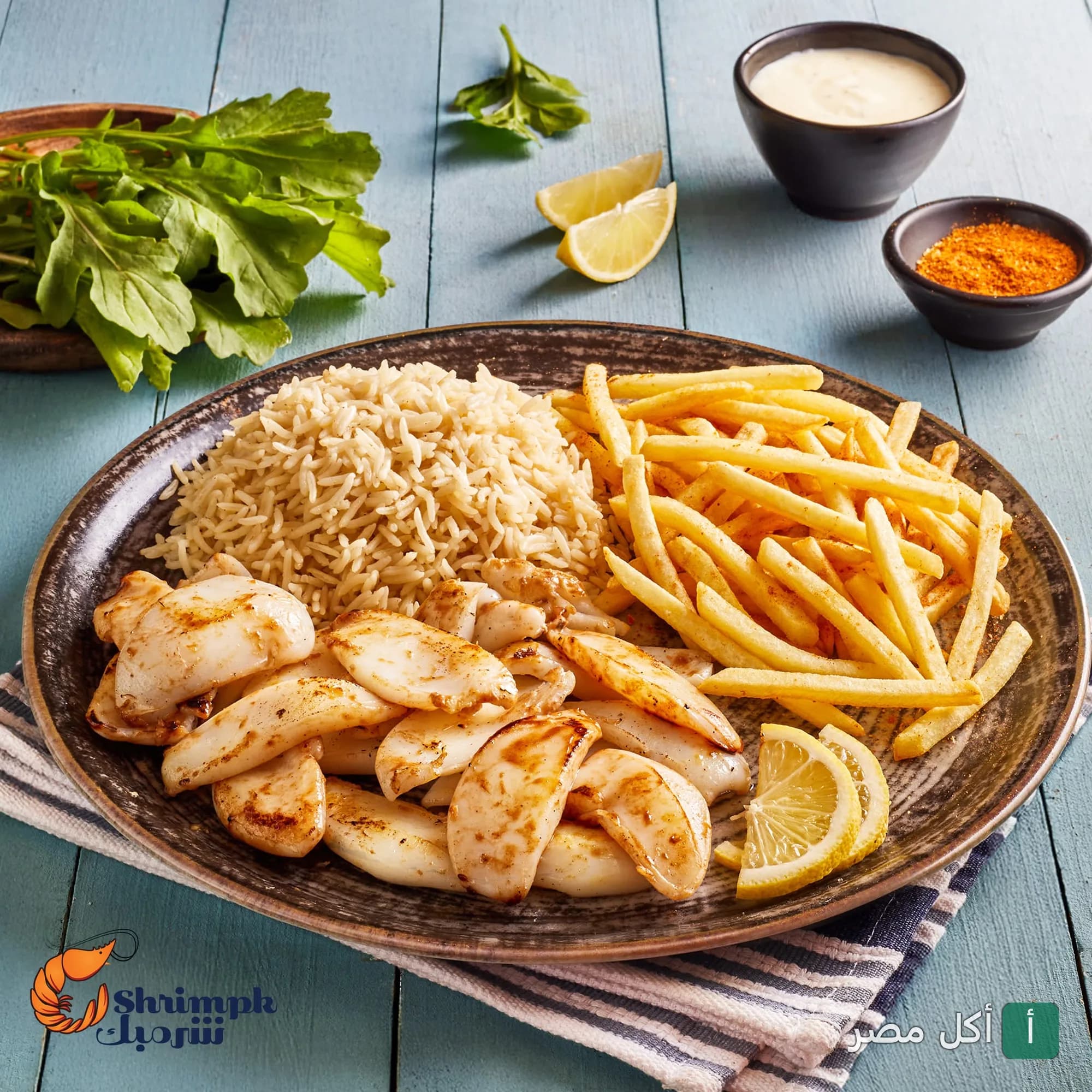 طبق سبيط مشوي مع أرز وبطاطس مقلية من مطعم شريمبك في سيدي جابر بالإسكندرية