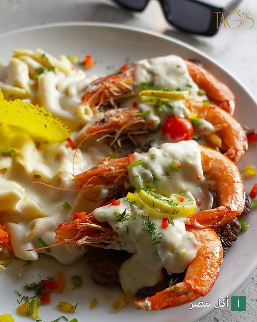 طبق جمبري بصوص الكريمة مع المكرونة في مطعم تاجز بسيدي جابر بالإسكندرية.