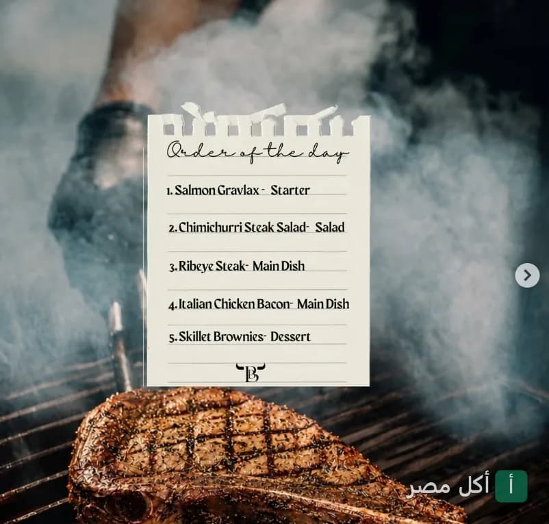 قائمة طعام يومية معروضة فوق قطعة ستيك مشوية على الجريل في مطعم بوتيجا ستيك هاوس ببرج العرب.
